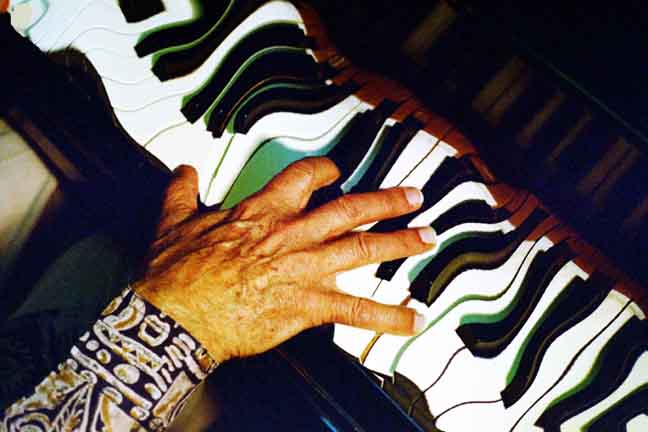 Halim El-Dabh playing piano